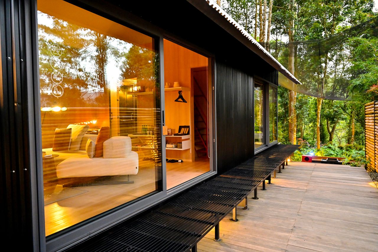 Modern cabin with warm interior and forest view in Java, Indonesia. Perfect for relaxation and nature retreats.